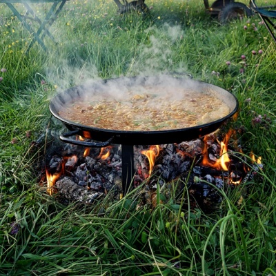 Cooking Paella over an open fire